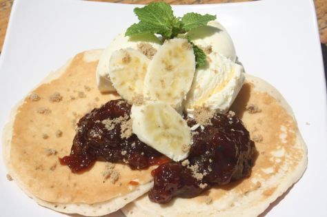 Banana jam served warm on pikelets, with fresh banana, brown sugar and mint